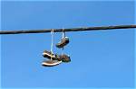 Why Do Shoes Hang from an Overhead Wire?